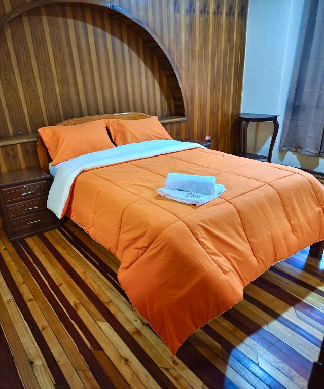Postel nebo postele na pokoji v ubytování Travel Hotel Quito