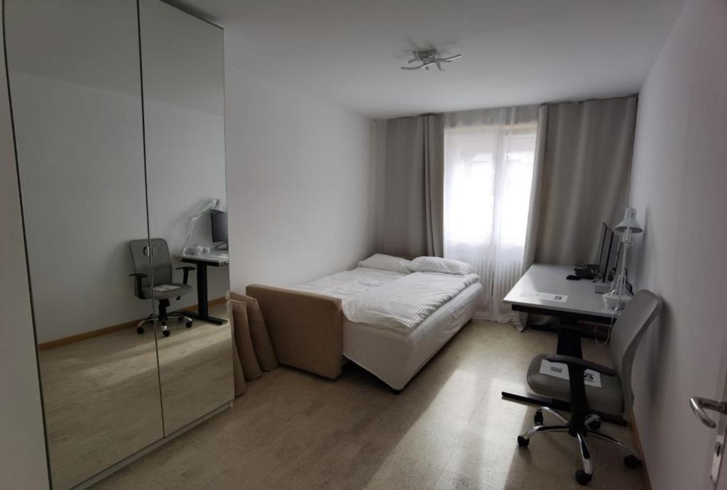 Postel nebo postele na pokoji v ubytování Casa-Casa Linthal