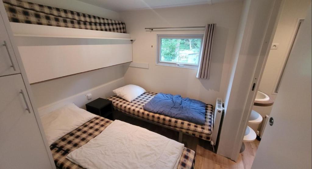 Postel nebo postele na pokoji v ubytování Tiny House des amis