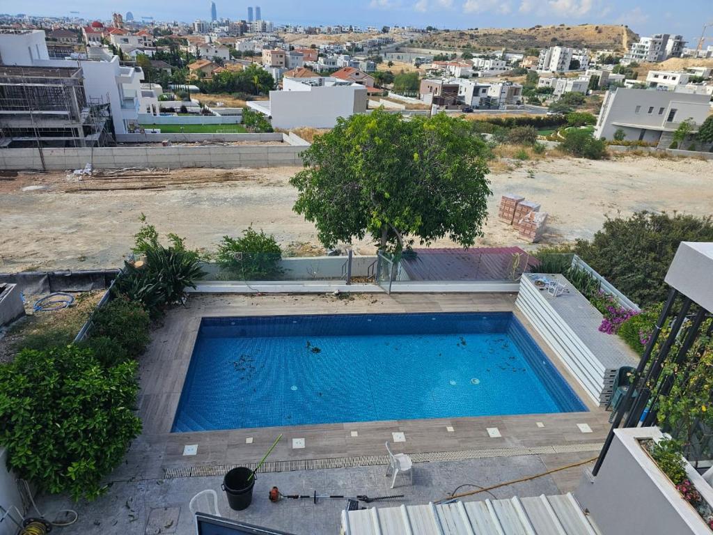 an overhead view of a swimming pool on top of a building at Hill Residence in Limassol