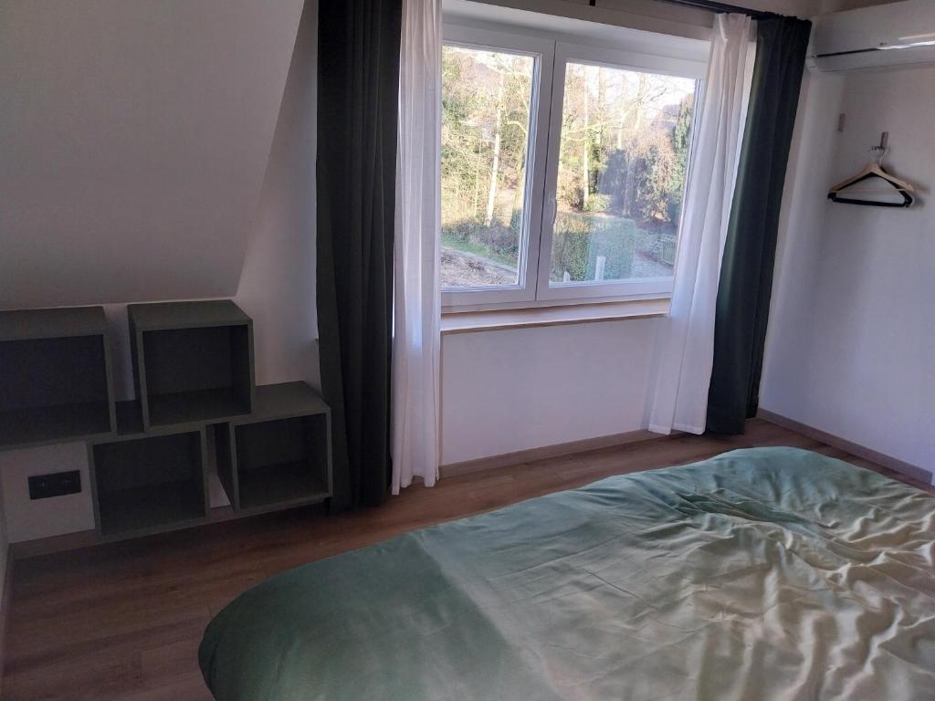 Postel nebo postele na pokoji v ubytování Vakantiewoning Yade