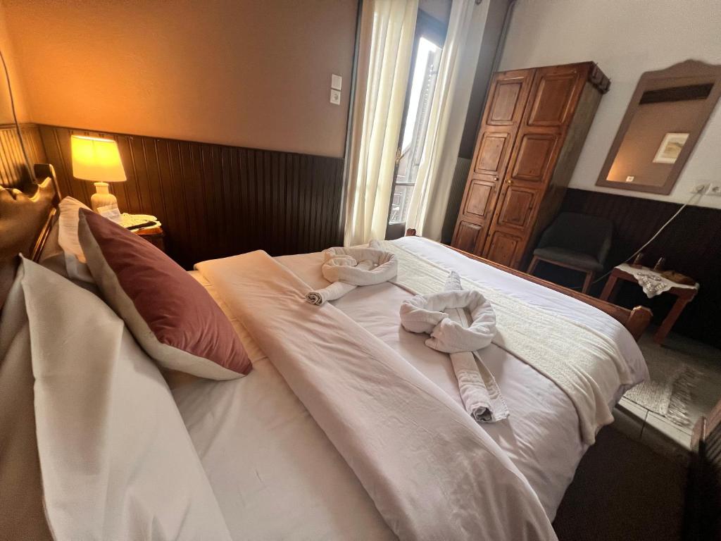 Postel nebo postele na pokoji v ubytování Pilioritiko Spiti