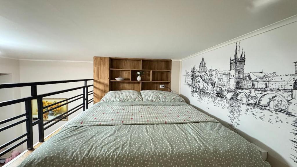 a bedroom with a bed with a drawing on the wall at Newly renovated apartment in Wenceslas square in Prague