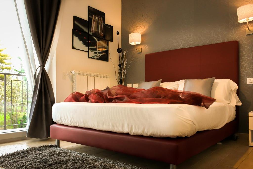 Postel nebo postele na pokoji v ubytování Hotel Rossovino Como