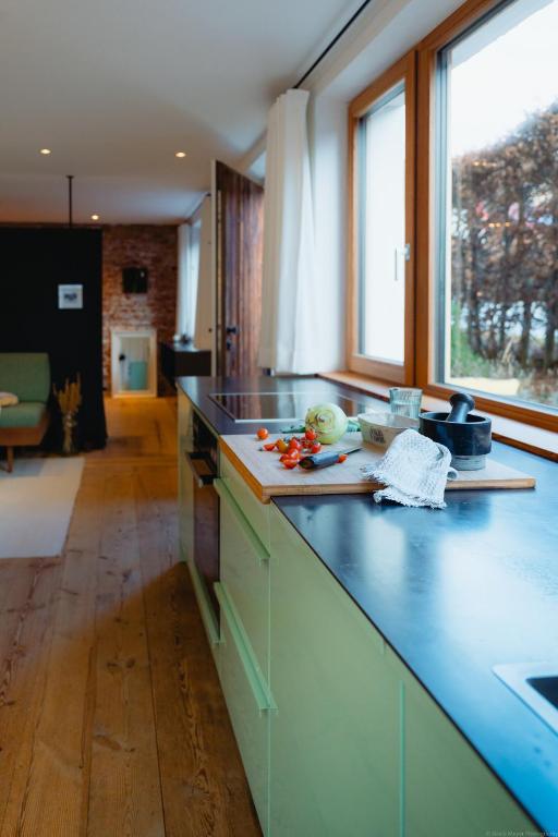 a kitchen with a blue counter top in a room at Ferienapartment Gasötz Berchtesgaden in Berchtesgaden