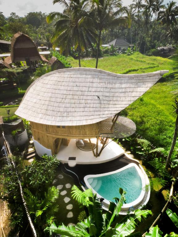 an aerial view of a resort with a swimming pool at JinengBali Eco Lodge in Tegalalang