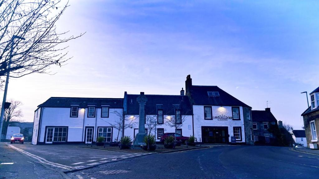 a white building on the side of a street at Lomond Hills Hotel & Health Club in Freuchie