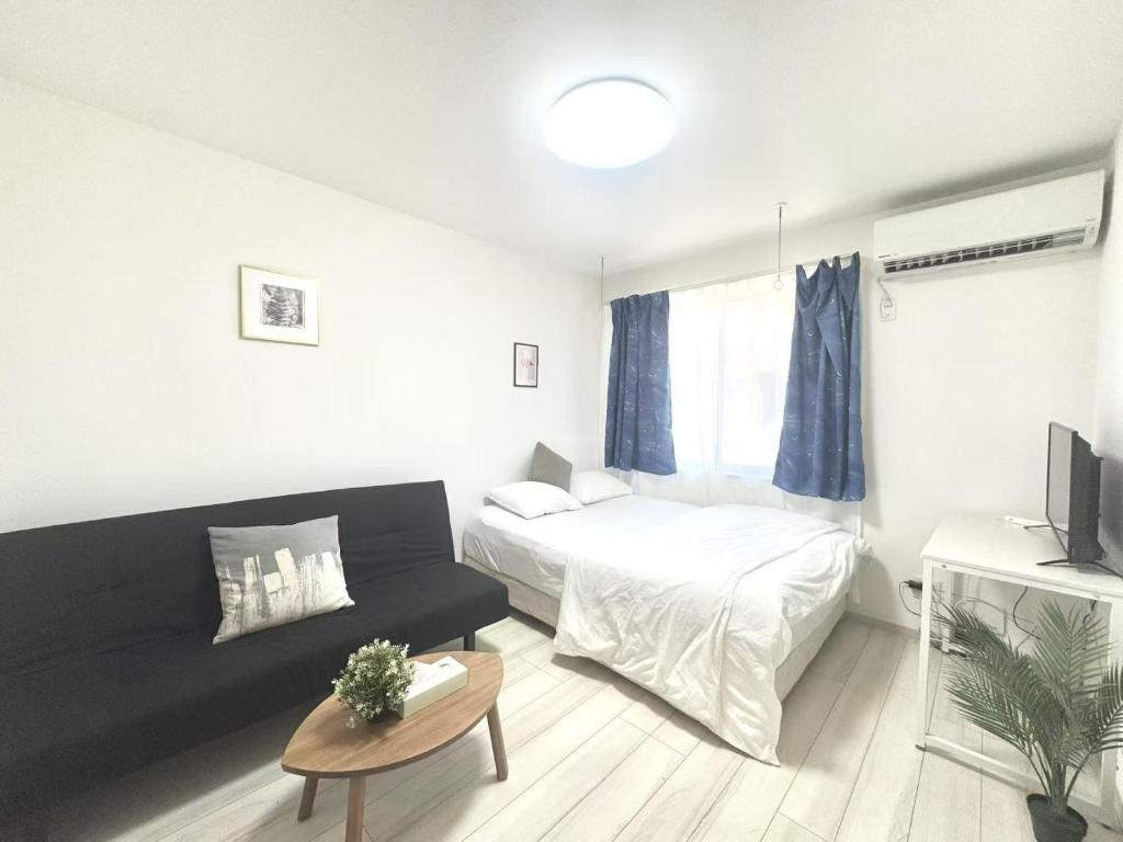 Postel nebo postele na pokoji v ubytování ティエラ北池袋