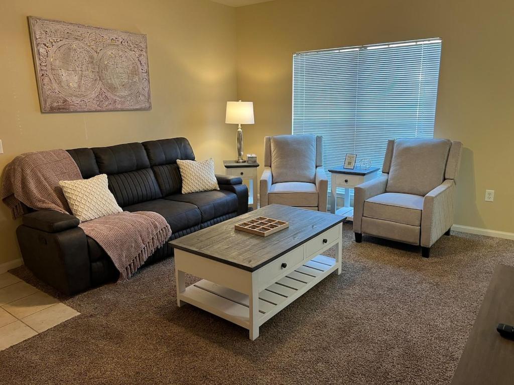 a living room with a couch and two chairs at Magnolia Bliss- 2BD-2BA - Gym-Pool-BBQ Grill in Tupelo