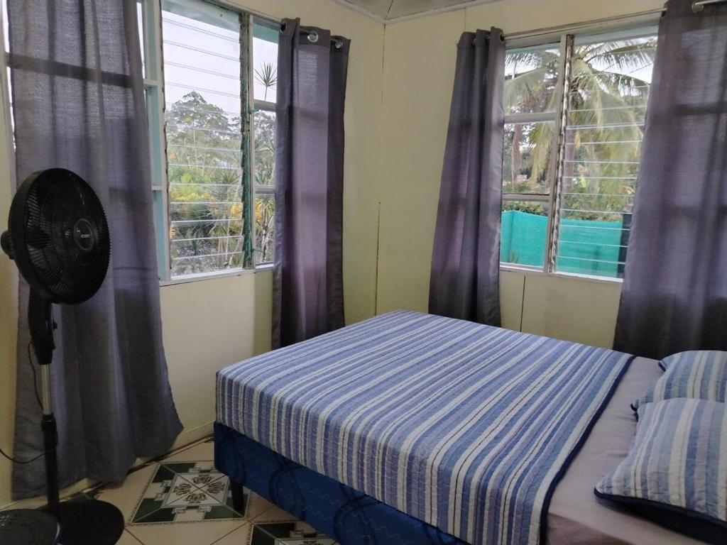 Postel nebo postele na pokoji v ubytování Doña Mary Caribbean House