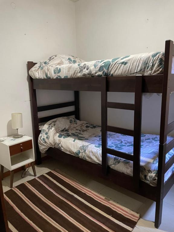 Ένα ή περισσότερα κρεβάτια σε δωμάτιο στο CasaAmarilla Viña del Mar