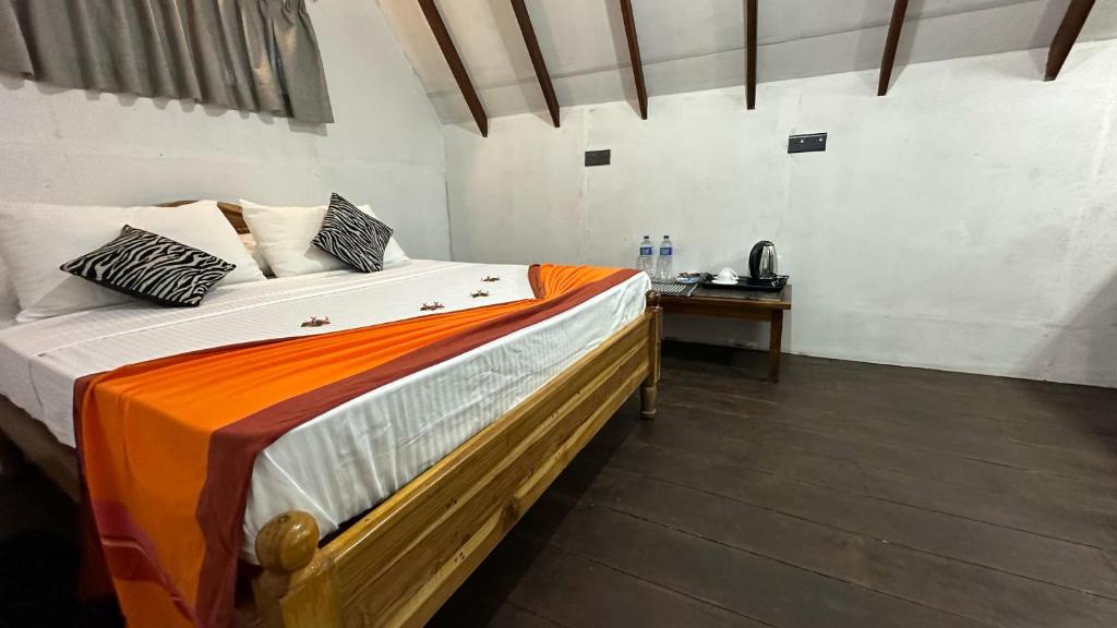 Postel nebo postele na pokoji v ubytování Sigiri Veenus Paradise