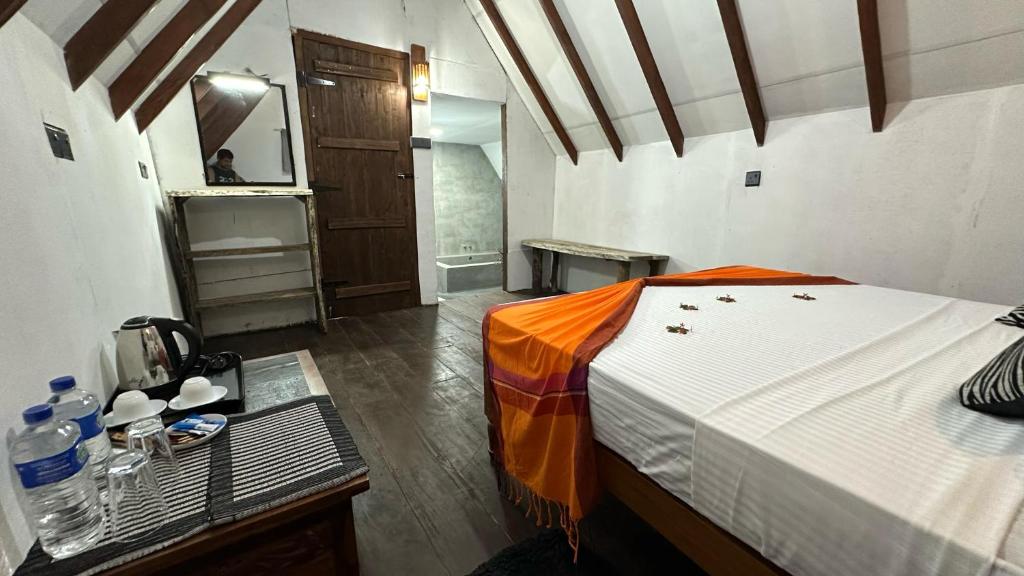 Postel nebo postele na pokoji v ubytování Sigiri Veenus Paradise
