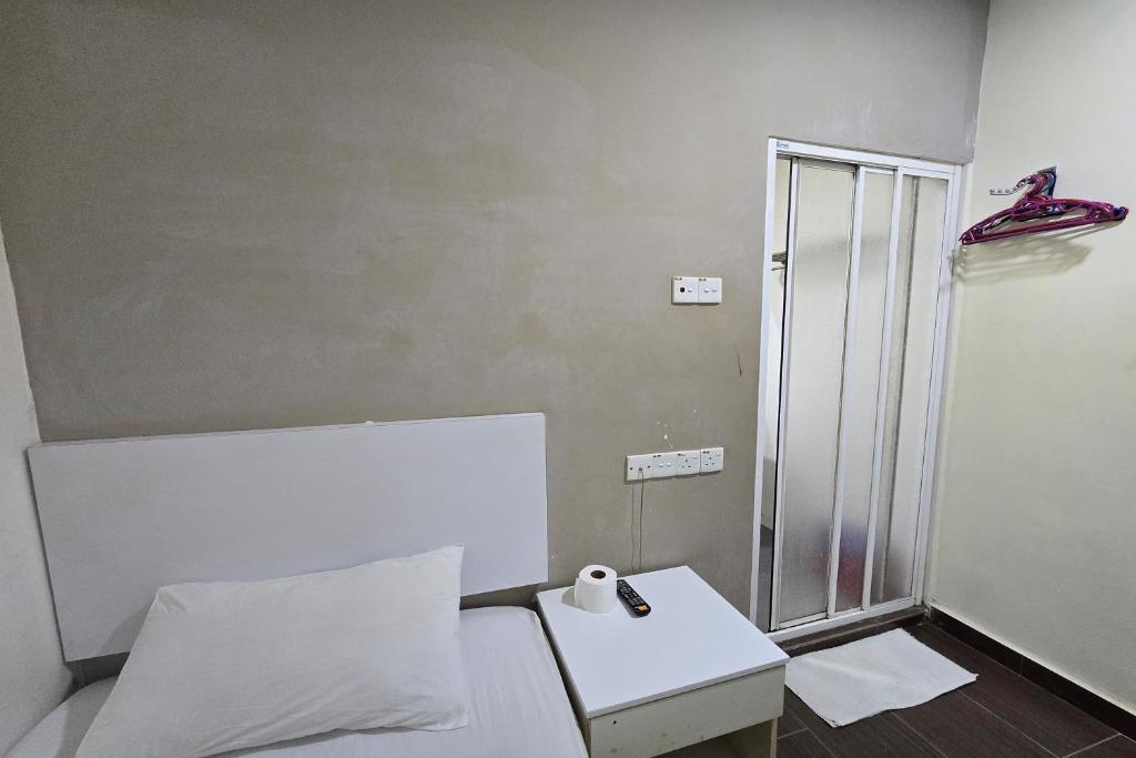 Postel nebo postele na pokoji v ubytování Fast Hotel Sri Gombak
