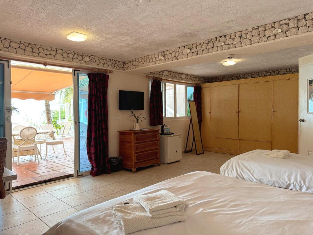 Postel nebo postele na pokoji v ubytování Sunset Beach Resort