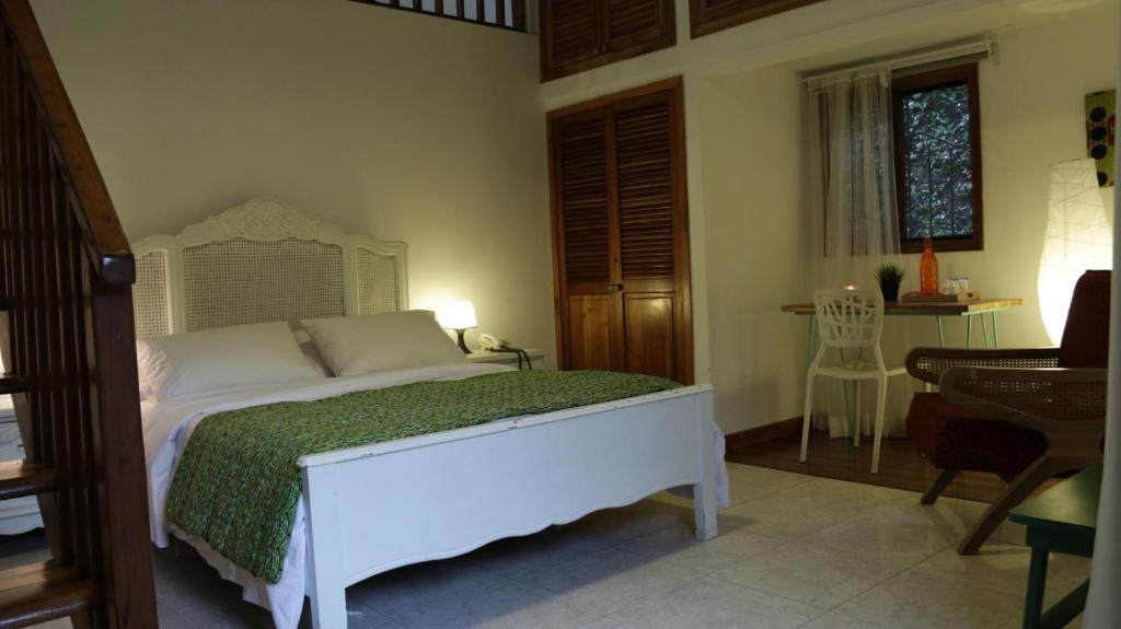 Postel nebo postele na pokoji v ubytování Iguanazu Bed & Breakfast