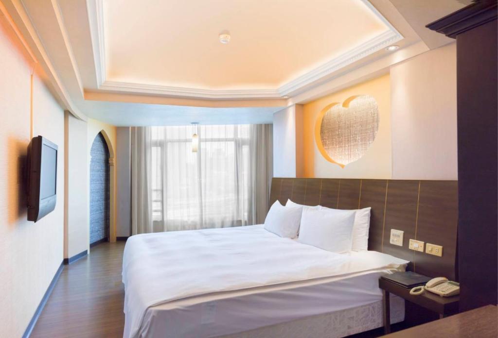 Postel nebo postele na pokoji v ubytování Bitan Hotel
