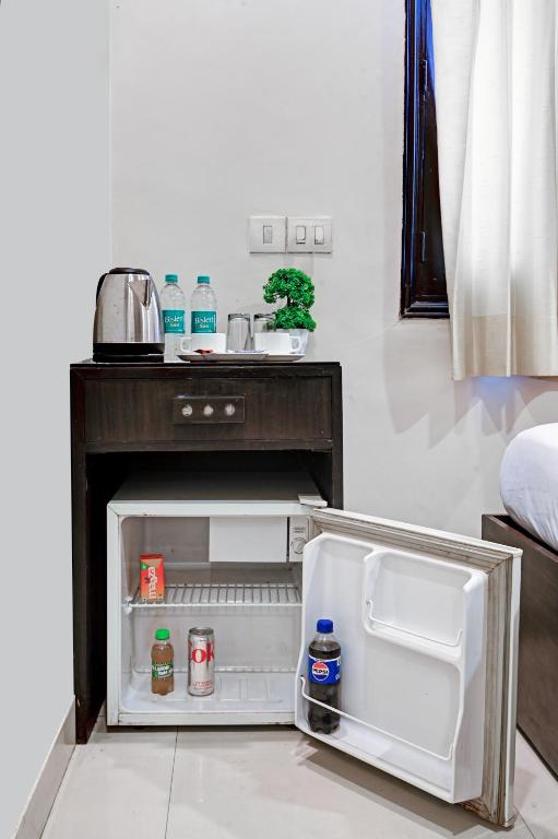 Postel nebo postele na pokoji v ubytování New Ammby Inn - Lajpat Nagar