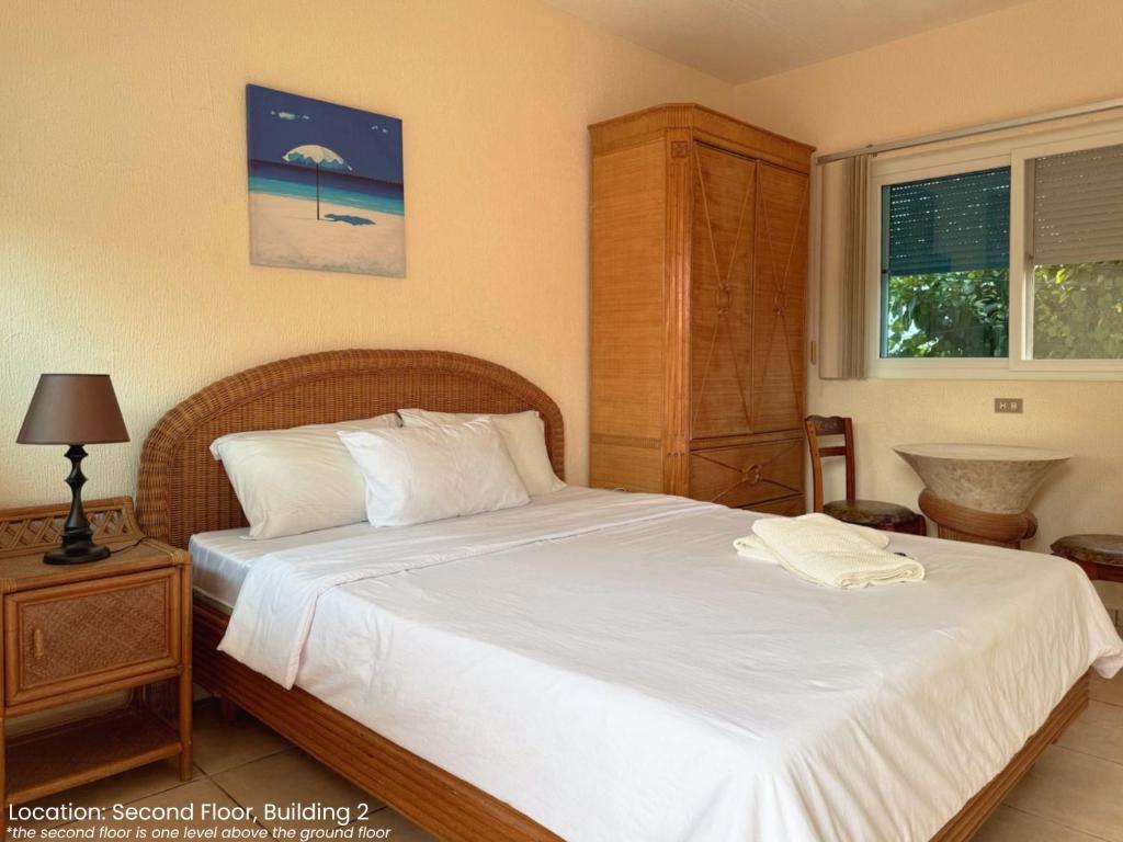 Postel nebo postele na pokoji v ubytování Sunset Beach Resort