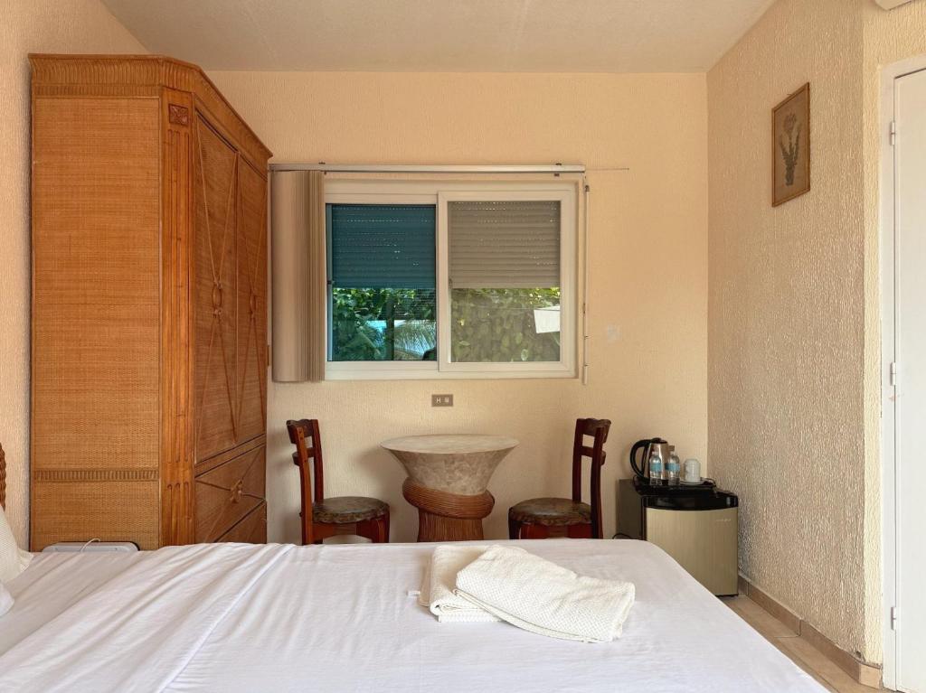 Postel nebo postele na pokoji v ubytování Sunset Beach Resort