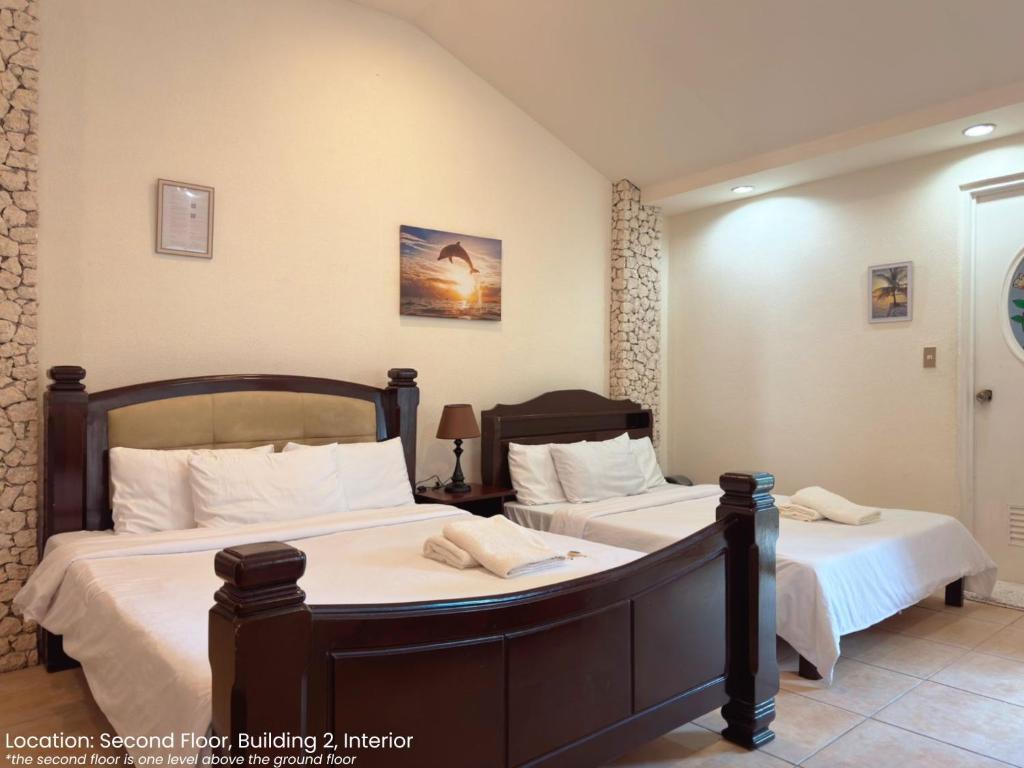 Postel nebo postele na pokoji v ubytování Sunset Beach Resort