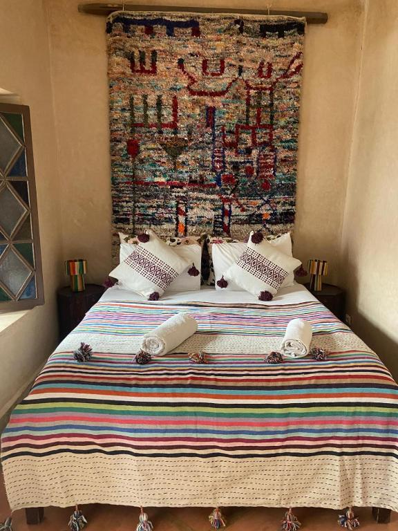 Postel nebo postele na pokoji v ubytování Riad Le Jardin de Lea, Suites & Spa
