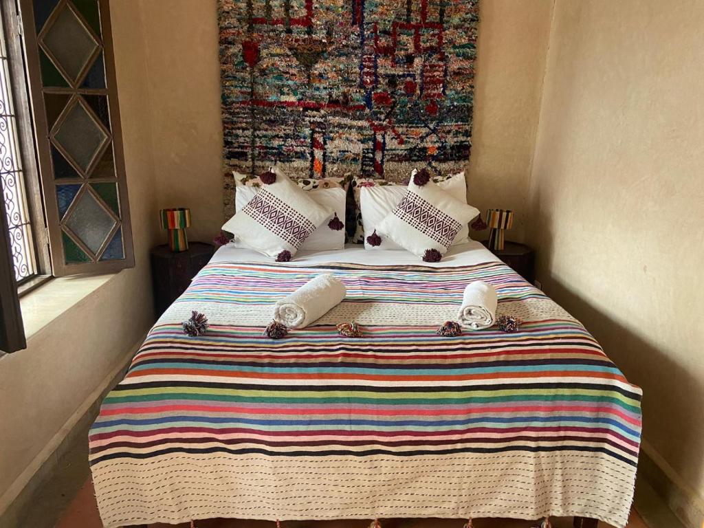 Postel nebo postele na pokoji v ubytování Riad Le Jardin de Lea, Suites & Spa