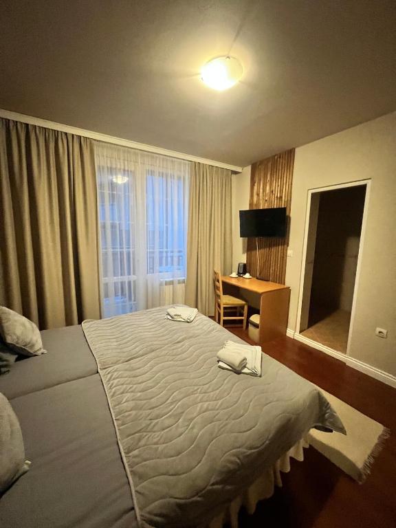 Postel nebo postele na pokoji v ubytování Zasheva Kushta Guesthouse