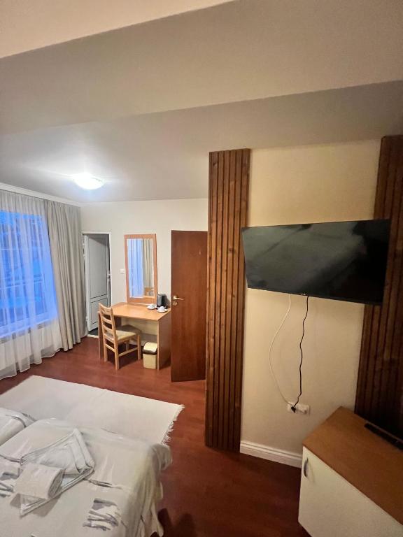 Postel nebo postele na pokoji v ubytování Zasheva Kushta Guesthouse
