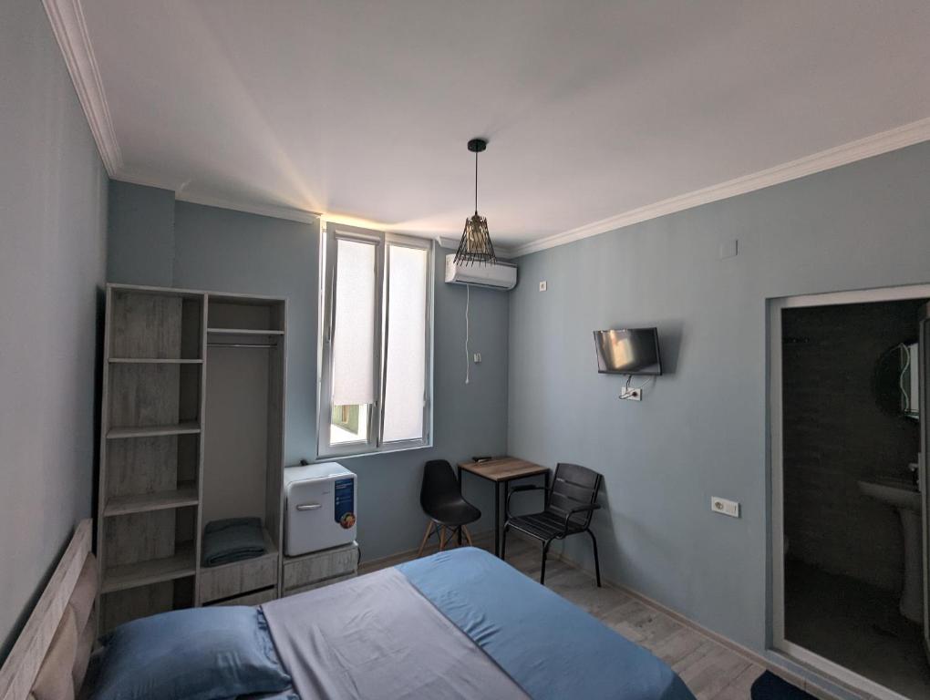 Postel nebo postele na pokoji v ubytování Compass hotel