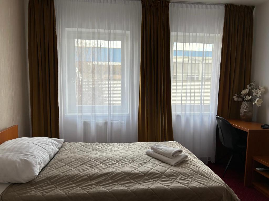 Postel nebo postele na pokoji v ubytování Hotel Evan u Hoffera
