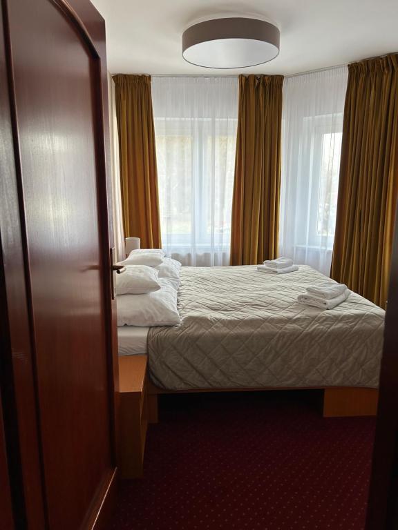 Postel nebo postele na pokoji v ubytování Hotel Evan u Hoffera