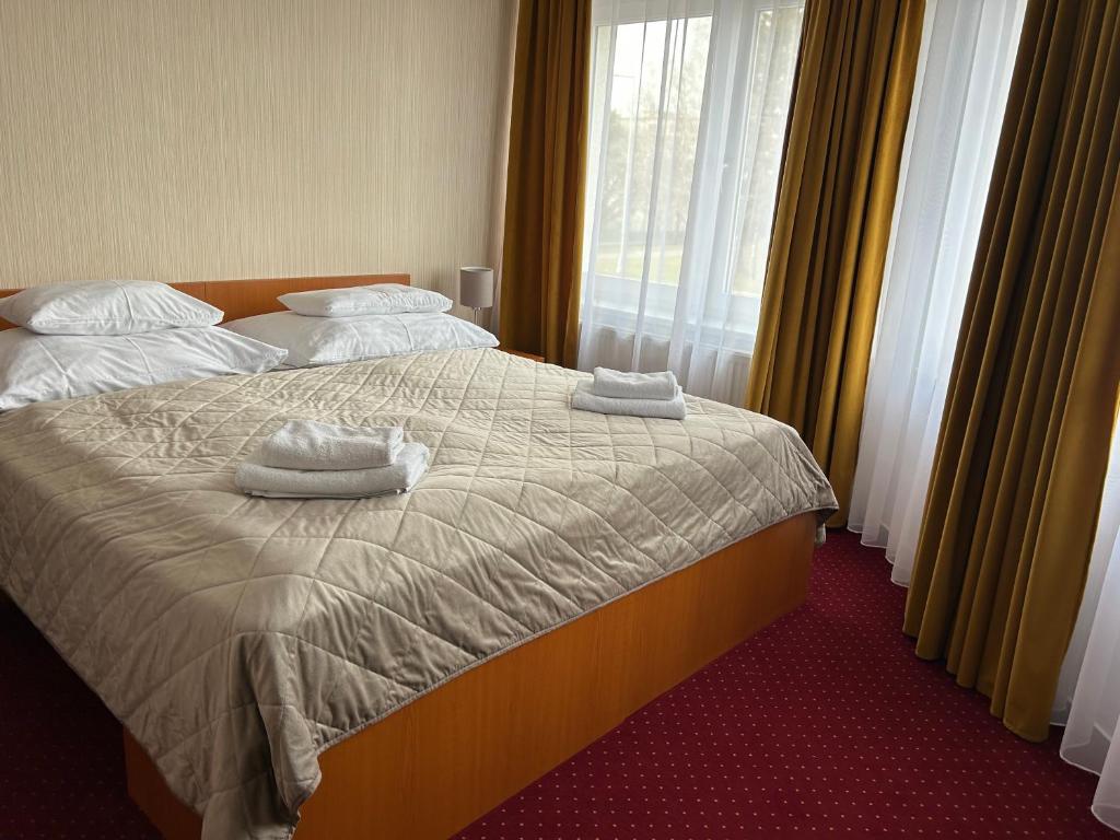 Postel nebo postele na pokoji v ubytování Hotel Evan u Hoffera