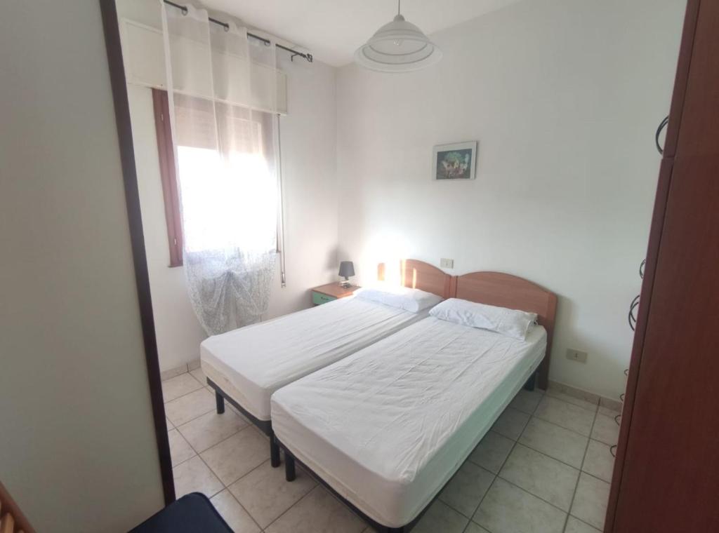 Postel nebo postele na pokoji v ubytování Villa Cortina