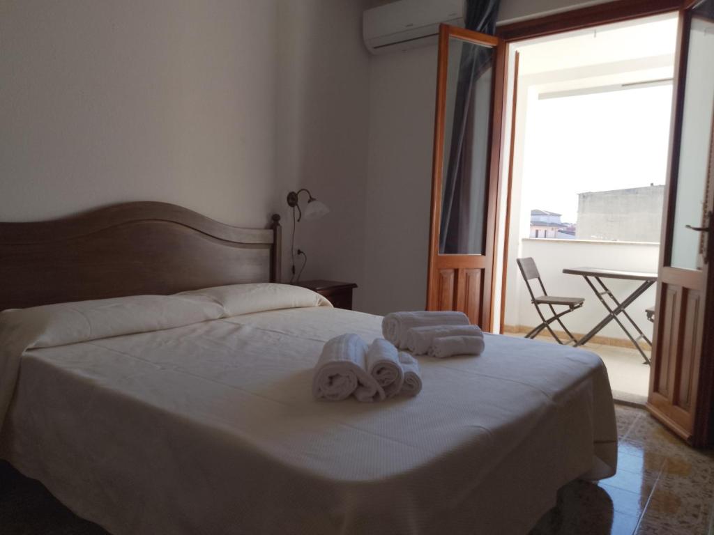 Postel nebo postele na pokoji v ubytování S' Agrùstu
