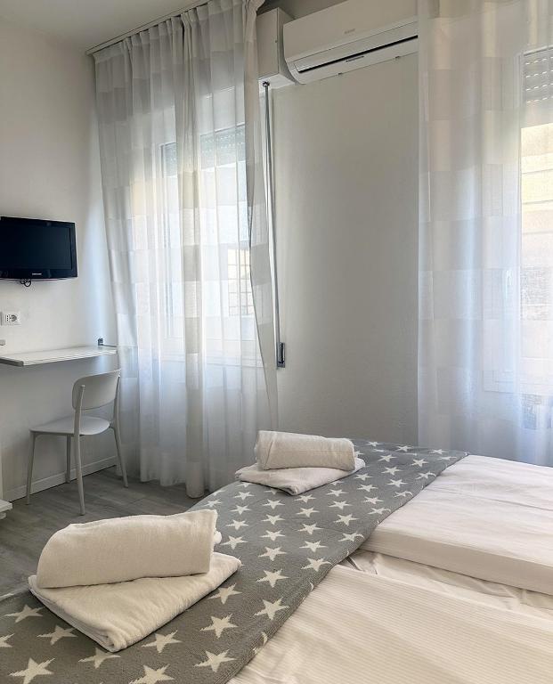 Postel nebo postele na pokoji v ubytování Albergo del Pozzo