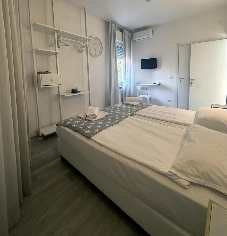 Postel nebo postele na pokoji v ubytování Albergo del Pozzo