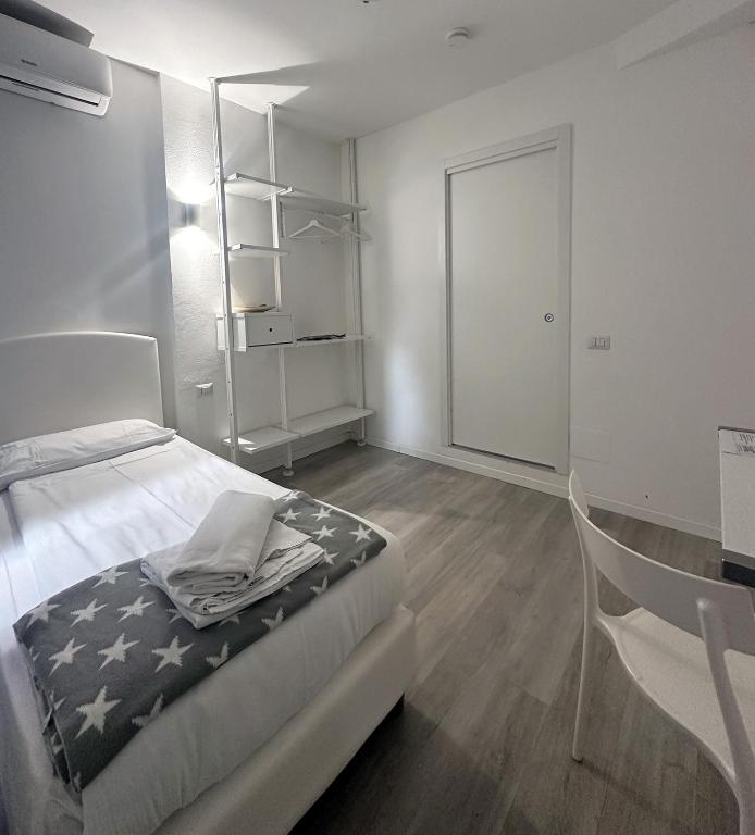 Postel nebo postele na pokoji v ubytování Albergo del Pozzo