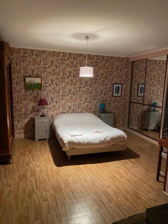 Postel nebo postele na pokoji v ubytování La Villa De L'etang Burgundy