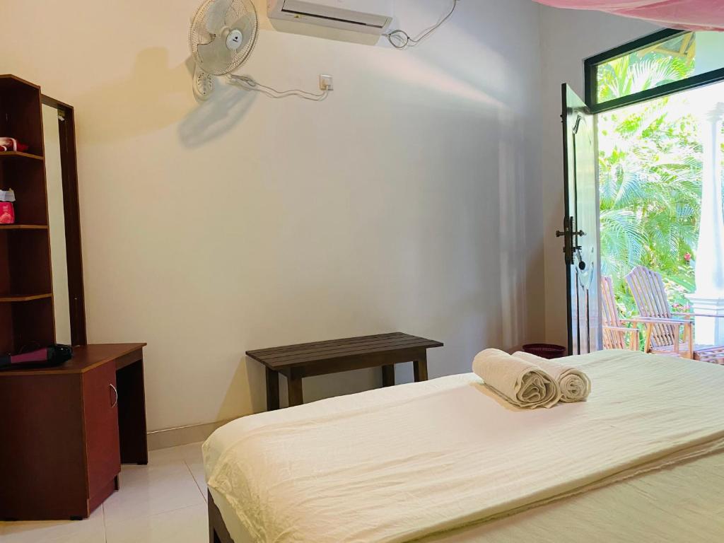 Postel nebo postele na pokoji v ubytování Fairview Dill homestay
