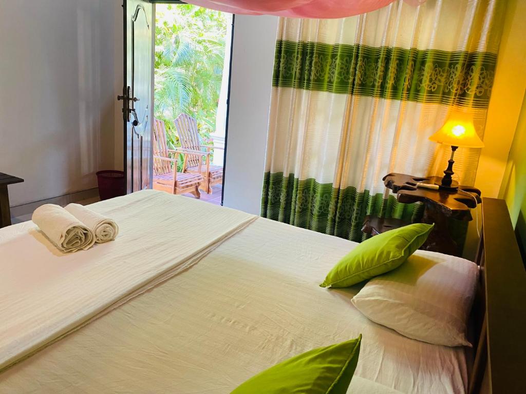 Postel nebo postele na pokoji v ubytování Fairview Dill homestay
