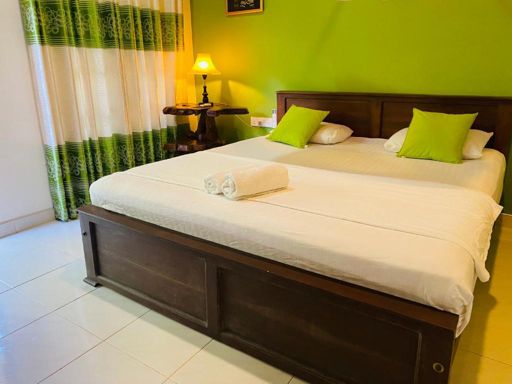 Postel nebo postele na pokoji v ubytování Fairview Dill homestay