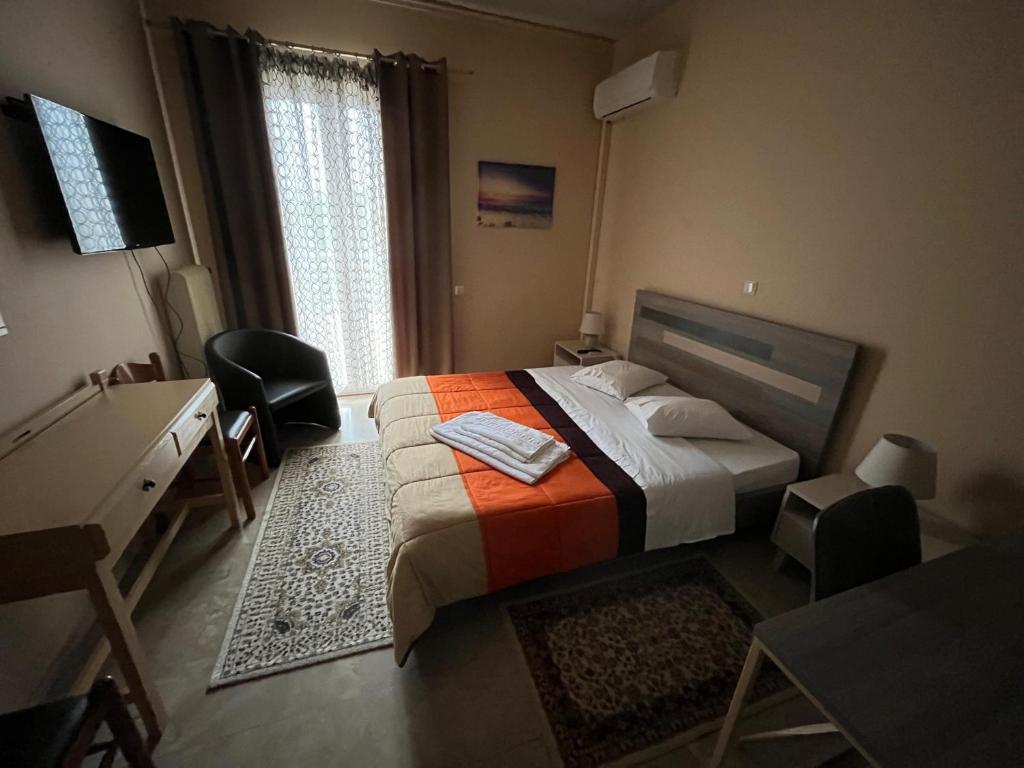 Postel nebo postele na pokoji v ubytování Hotel Stratos