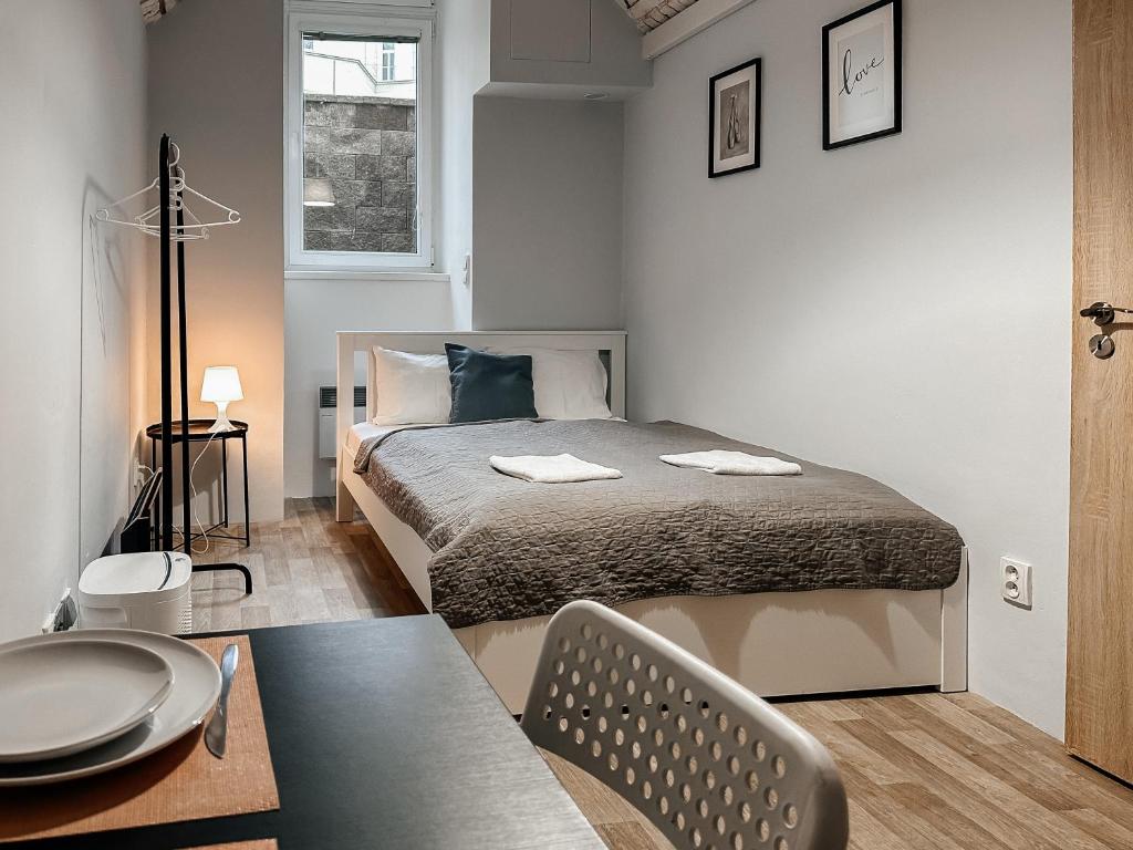 Postel nebo postele na pokoji v ubytování ELSO apartments