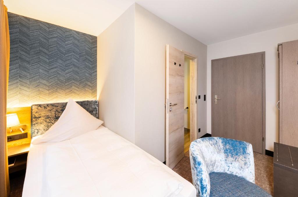 Letto o letti in una camera di Hotel Waldmühle