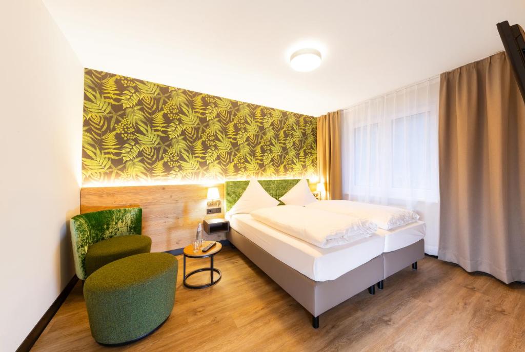 Letto o letti in una camera di Hotel Waldmühle