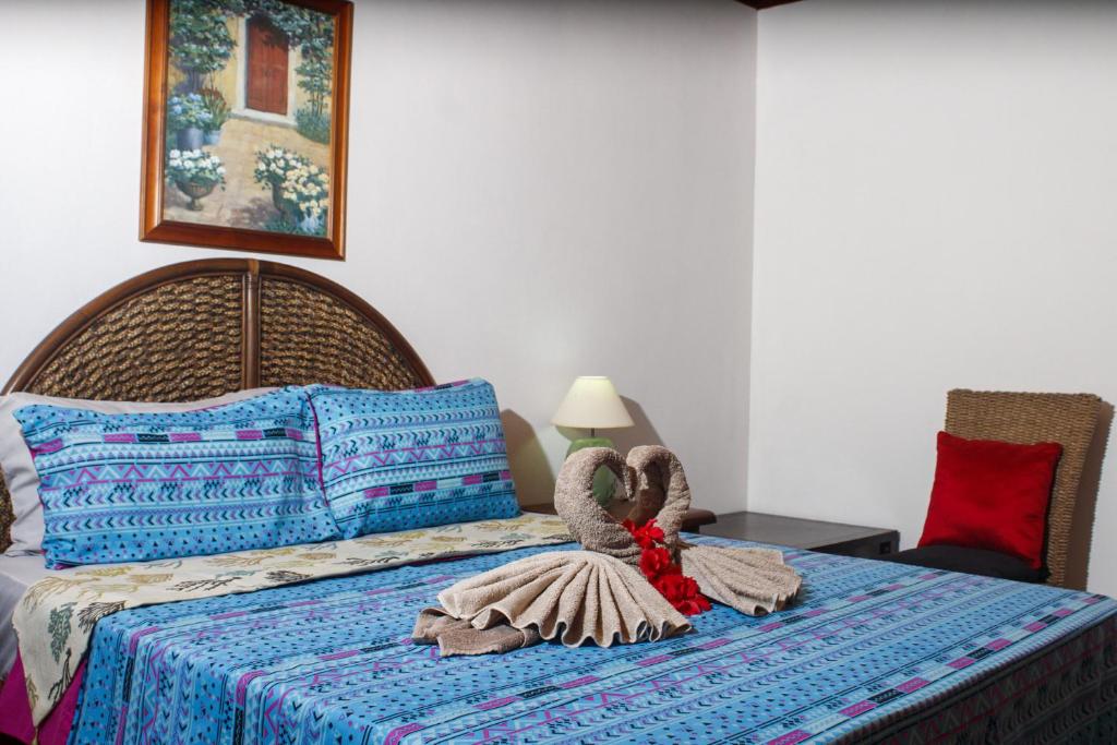 Postel nebo postele na pokoji v ubytování Nid'Aigle Lodge