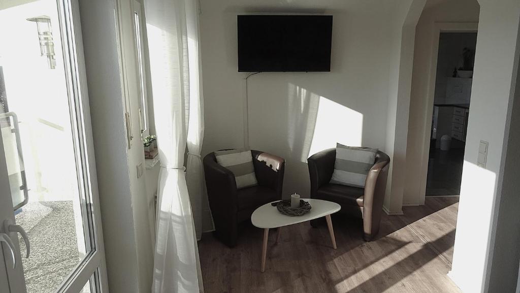 TV a/nebo společenská místnost v ubytování Gästehaus Becker