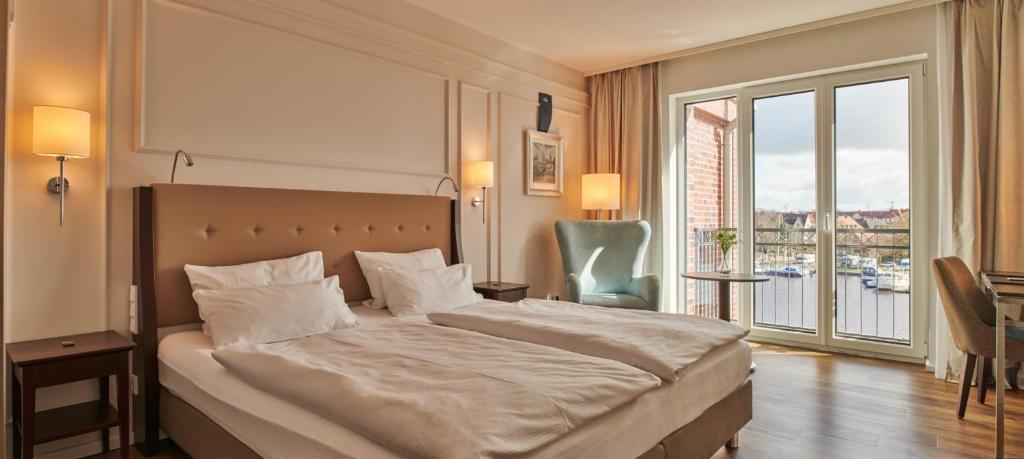 Postel nebo postele na pokoji v ubytování Hotel am Delft