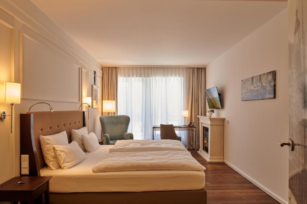 Postel nebo postele na pokoji v ubytování Hotel am Delft